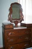 Antique Victorian dresser with marble insert, glove boxes, fruit motif pulls and mirror.