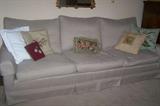 Vintage traditional sofa, needlepoint decorative pillows.