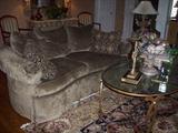 Area rugs, sofa, chairs, coffee table and lots of designer touches.