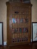 Gorgeous rustic bookcase with iron gate-style door--stunning!