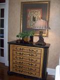 One of two matching chests, framed prints and decorative table top items.