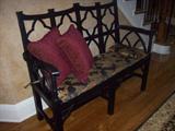 Charming settee with pillows.