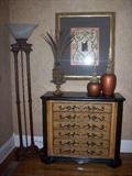 One of two matching chests, framed prints and decorative table top items.