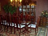 Exquisite dining room group--table, chairs, china cabinet, chest, area rug, china, and crystal.
