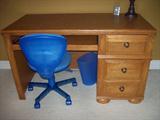 One of two student desks with chairs.