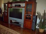Another entertainment center with TV and more.
