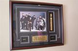 Decor and framed art. "The Sopranos" framed photo and memorabilia shown here.
