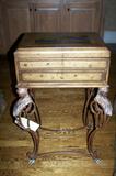 Accent table with lift-top; wood and leather inset.