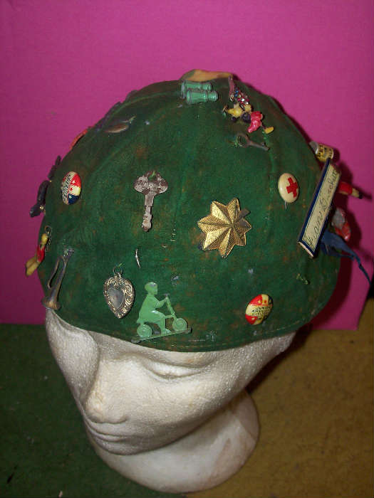 Vintage beanie from 1940s or so, loaded with vintage Cracker Jack charms, some metal.