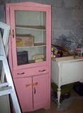 Cute vintage kitchen cupboard--pretty in pink.