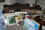 Room full of original art and prints--some framed, some unframed--local artists and more. That's an antique sofa hiding in the background.