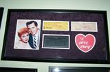Photo framed with cancelled checks signed Lucille Ball and Desi Arnaz.