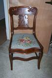 Antique mahogany chair with needlepoint seat.