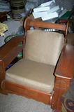 Heavy wooden-framed chair with wide arms, removable cushions--part of 3-piece set.