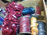 Box full of leather strips--yards and yards in different colors.