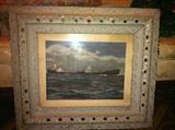 One of several antique and vintage prints in decorative ornate frames.