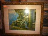 One of several antique and vintage prints in decorative ornate frames.