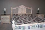 Queen-size bedroom group includes headboard, footboard, box springs, mattress, dresser and 2 bedside tables.