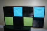 Storage cabinet with fabric drawers.