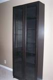 Bookcase with glass doors.