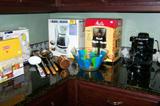 Assorted kitchenware, small appliances and more.