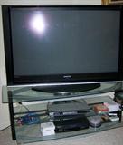 Flat screen TV with stand.