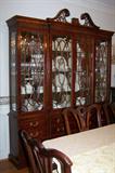 Stunning mahogany Henredon Chippendale breakfront (china cabinet). Upper cabinet is a separate piece and rests on the cabinet deck. (This piece was originally priced at $9,000 in 2000.) This piece is part of a formal dining room group.
