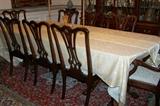 Stunning mahogany Chippendale table with double pedestal with 8 chairs.
