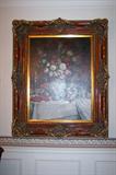 Large floral painting in ornate frame.