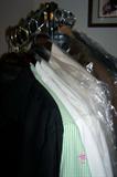 Closets full of men's clothing and accessories--suits, sportscoats, pants, shirts, ties, scarves, sweaters, shoes and boots. These clothing items are new and like-new, clean and well cared for. Suit sizes are 40 short, shirts are medium sizes. There are many name-brand and designer labels including Armani.