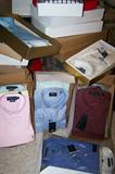 Dozens of dress shirts, new in package.