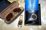 Seiko and ESQ watches, assorted men's sunglasses and reading glasses.