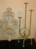 Ornate iron sconce and candle stand.