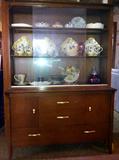 Vintage Drexel china cabinet with milk glass, dinnerware, and glassware.