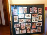 Framed collage of antique-style post cards.
