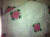 Pair crocheted bedspreads--white with pink & green flowers.