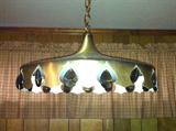 Mid-century metal light fixture with smoky prisms.