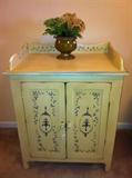 Contemporary painted chest with doors and shelves.