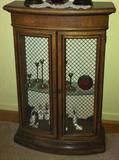 Small vintage cabinet with metal mesh doors.