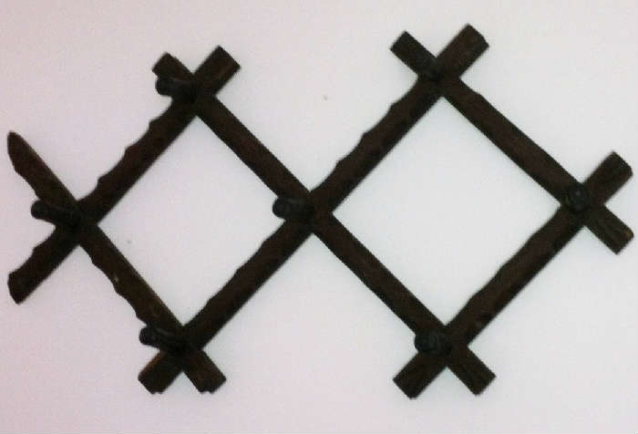 Primitive adjustable hat/coat rack.