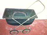 Vintage doll-size baby buggy.