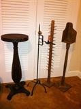 Antique plant stand, wrought iron candle stand, wooden spool holder, wooden candle stand.