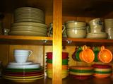 New Fiesta dinnerware and large collection of Pfaltzgraff "Folk Art" dinnerware with many extra pieces.