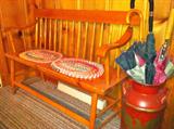 Vintage/antique deacon's bench and painted milk can.