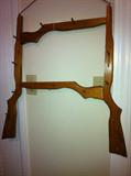 Unique hat rack made with gun shapes.