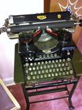 Royal #10 typewriter, original glass side panels and antique typewriter stand.