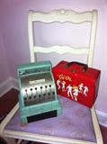 Vintage toy cash register and vintage red vinyl go-go case.