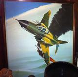 Framed painting of military aircraft.