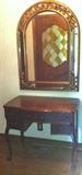 Antique knee-hold desk/table, decorative mirror.