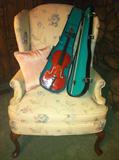 Pair floral wing back chairs; Cremona small violin.